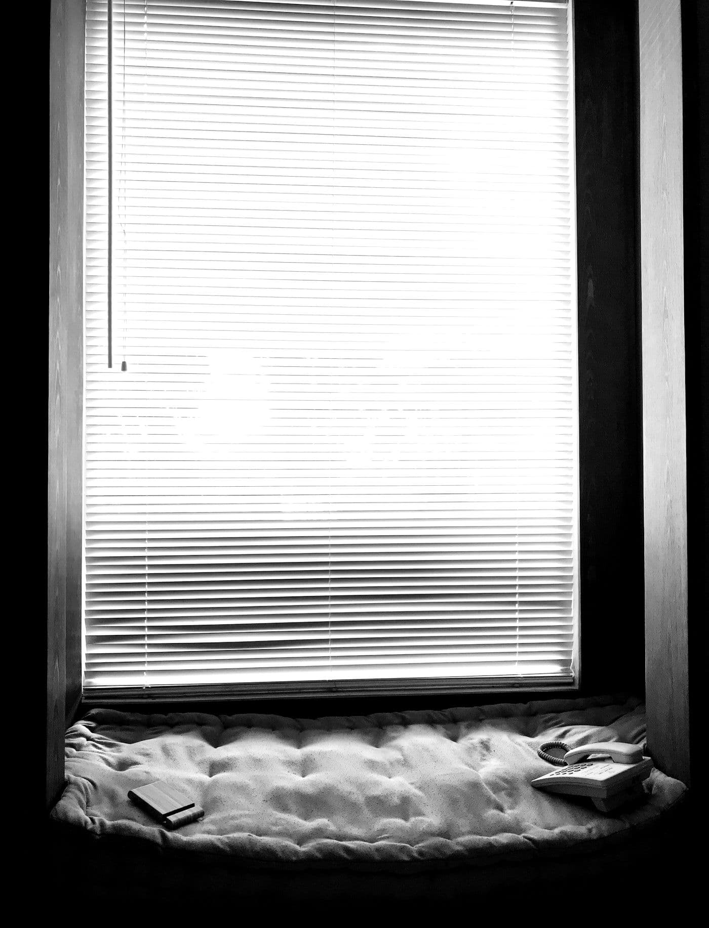 A window seat with the blinds down